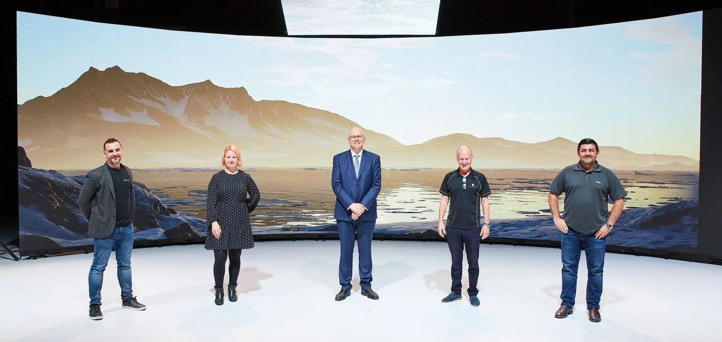 Ian Cope and collaborators beside a curved LED wall during an Adelaide virtual production demonstration in 2020